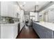 Spacious kitchen with stainless steel appliances, large island, and sleek white and gray cabinetry at 892 Gramercy Hills Ln, Mableton, GA 30126
