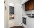 Convenient laundry room with modern washer and dryer, next to a room with a chalkboard wall and wooden bench at 892 Gramercy Hills Ln, Mableton, GA 30126