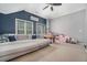 Spacious living room with tall ceilings, large windows, and playful decorations at 892 Gramercy Hills Ln, Mableton, GA 30126