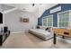 Open living room with gray walls, neutral carpet, a foosball table, and a dart board at 892 Gramercy Hills Ln, Mableton, GA 30126