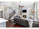 Inviting living space featuring hardwood floors, fireplace, staircase and built-in bookshelves at 892 Gramercy Hills Ln, Mableton, GA 30126