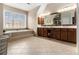 Spacious main bathroom boasting a large tub, tile flooring, and a dual sink vanity at 892 Gramercy Hills Ln, Mableton, GA 30126