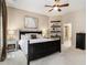 Comfortable main bedroom featuring a ceiling fan, carpet, and shelves for a cozy retreat at 892 Gramercy Hills Ln, Mableton, GA 30126