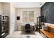 Functional home office space with a chalkboard wall, desk, and shelving, providing a productive environment at 892 Gramercy Hills Ln, Mableton, GA 30126