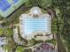 Aerial view of a community pool with tennis courts and lots of seating, perfect for summer relaxation at 892 Gramercy Hills Ln, Mableton, GA 30126