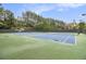 Tennis courts feature a green exterior, blue courts, and well-maintained nets at 892 Gramercy Hills Ln, Mableton, GA 30126