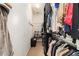 Organized walk-in closet featuring ample hanging space, shelving, and a shoe rack at 892 Gramercy Hills Ln, Mableton, GA 30126