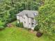 Aerial view of a home with large yard, mature trees, two story porch, and adjacent to the street at 1160 Foster Nw Pl, Atlanta, GA 30318