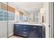 Modern bathroom with double vanity, glass shower, and wood floors at 1160 Foster Nw Pl, Atlanta, GA 30318