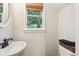Cozy bathroom features natural lighting, vanity sink, and neutral wall color at 1160 Foster Nw Pl, Atlanta, GA 30318