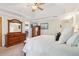 Bedroom features tray ceilings, ceiling fan, carpeted floors, and closet space at 1160 Foster Nw Pl, Atlanta, GA 30318