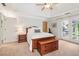 Bright bedroom features large windows, ceiling fan, and carpeted floors at 1160 Foster Nw Pl, Atlanta, GA 30318