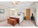 Cozy bedroom features tray ceilings, ceiling fan, and closet space at 1160 Foster Nw Pl, Atlanta, GA 30318