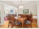 Traditional dining room with wood table, seating for six, and views into the living room at 1160 Foster Nw Pl, Atlanta, GA 30318