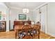Traditional dining room with hardwood floors, a table setting for six, and neutral paint at 1160 Foster Nw Pl, Atlanta, GA 30318