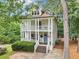 Charming two-story home with a double porch, stately columns, and a well-maintained front yard at 1160 Foster Nw Pl, Atlanta, GA 30318