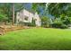 Charming home exterior with spacious lawn and meticulously maintained landscape at 1160 Foster Nw Pl, Atlanta, GA 30318
