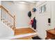 Bright foyer with hardwood floors, coat hooks, and a staircase leading to the upper level at 1160 Foster Nw Pl, Atlanta, GA 30318