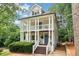 Inviting two-story home featuring a charming double porch, perfect for enjoying the outdoors at 1160 Foster Nw Pl, Atlanta, GA 30318