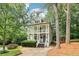 Inviting two-story home with a charming double porch and beautifully landscaped front yard at 1160 Foster Nw Pl, Atlanta, GA 30318
