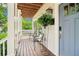Cozy covered front porch, adorned with plants and seating, provides a relaxing welcome at 1160 Foster Nw Pl, Atlanta, GA 30318