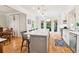 Bright kitchen with a large island, white cabinets, modern lighting, and stainless steel appliances at 1160 Foster Nw Pl, Atlanta, GA 30318
