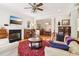 Warm and inviting living room with fireplace, piano, and hardwood floors, perfect for gatherings at 1160 Foster Nw Pl, Atlanta, GA 30318