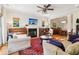 Cozy living room with a fireplace, piano, and comfortable seating, perfect for relaxation and entertaining at 1160 Foster Nw Pl, Atlanta, GA 30318