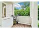 Enclosed porch with storage freezer offering views of the surrounding foliage at 1160 Foster Nw Pl, Atlanta, GA 30318