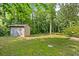 View of backyard featuring a shed with a lawn at 1594 Pine Glen Cir, Decatur, GA 30035