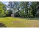 View of the backyard featuring a shed with a lawn at 1594 Pine Glen Cir, Decatur, GA 30035