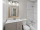 Modern bathroom featuring sleek vanity, toilet, and a tiled shower/tub combination at 1594 Pine Glen Cir, Decatur, GA 30035