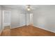 Bedroom featuring hardwood floors, a ceiling fan, and closet, and a door leading to a bathroom at 1594 Pine Glen Cir, Decatur, GA 30035