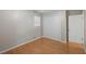 A bright bedroom with wood floors and closet at 1594 Pine Glen Cir, Decatur, GA 30035