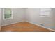 Bright bedroom featuring laminate floors and a window, creating a cozy atmosphere at 1594 Pine Glen Cir, Decatur, GA 30035