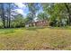 Attractive one-level home with a well-manicured lawn, attached garage, and surrounded by mature trees at 1594 Pine Glen Cir, Decatur, GA 30035
