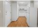 Functional kitchen with white cabinets, laminate flooring, and essential appliances at 1594 Pine Glen Cir, Decatur, GA 30035