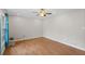 Large living room featuring light-colored walls, hardwood floor and a ceiling fan at 1594 Pine Glen Cir, Decatur, GA 30035