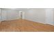 Large living room featuring laminate flooring and ample space for various layouts at 1594 Pine Glen Cir, Decatur, GA 30035