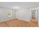 Bright living room with laminate flooring and natural light from a window at 1594 Pine Glen Cir, Decatur, GA 30035