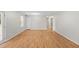Spacious open-concept living area with laminate flooring and access to a hallway at 1594 Pine Glen Cir, Decatur, GA 30035