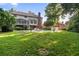 Expansive backyard featuring a well-maintained lawn, mature trees, and a swimming pool, creating a private oasis at 314 Savannah Pl, Loganville, GA 30052