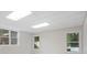 Finished basement with tile ceiling and view of the pool at 314 Savannah Pl, Loganville, GA 30052