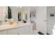 Bathroom featuring single sink vanity, white cabinets, and a walk in shower at 314 Savannah Pl, Loganville, GA 30052