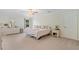 Spacious bedroom with neutral carpet, ceiling fan, and abundant natural light at 314 Savannah Pl, Loganville, GA 30052