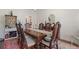 Well-appointed dining room featuring a large table with seating for six and stylish accents at 314 Savannah Pl, Loganville, GA 30052