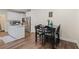 Eat-in kitchen with white cabinetry, a center island, and stainless steel appliances at 314 Savannah Pl, Loganville, GA 30052