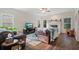 Cozy living room with a fireplace, comfortable seating, and plenty of natural light for relaxation at 314 Savannah Pl, Loganville, GA 30052