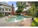 Inviting backyard pool with lounge chairs, perfect for relaxing and entertaining amidst serene surroundings at 314 Savannah Pl, Loganville, GA 30052