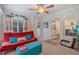 Bright sunroom with large windows, hardwood floors, and comfortable seating at 314 Savannah Pl, Loganville, GA 30052